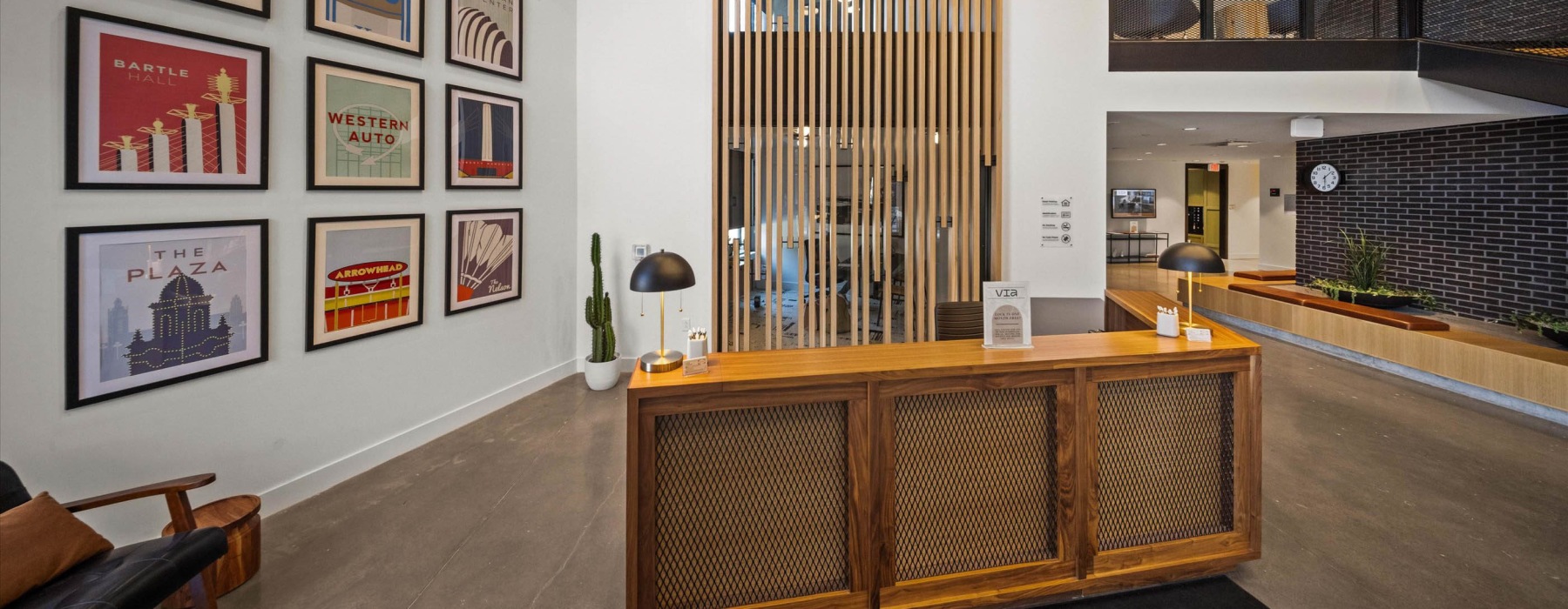 a front desk area with wall art