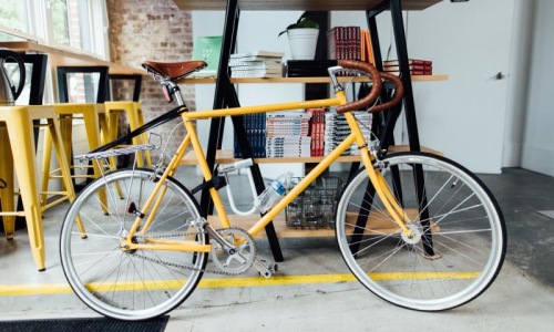 a bicycle with a yellow frame